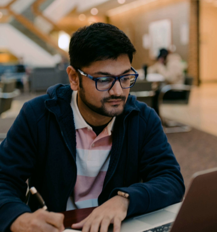 Graduate student studying on CSU's campus