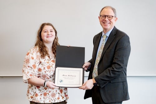 A&S 2025 Fall Salutatorian Mira DiPierro pictured with Dean Andy Kersten