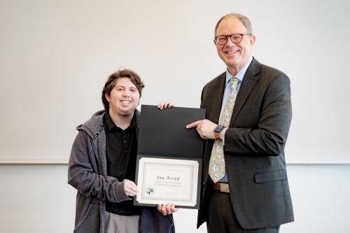 A&S 2025 Fall Outstanding Scholar Jay Kropf pictured with Dean Andy Kersten