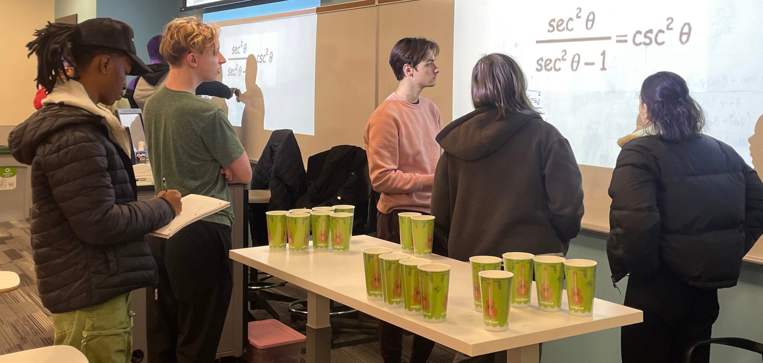 Winter Institute participants reviewing trigonometric proofs.