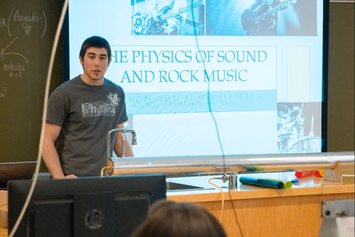 a physics grad student giving a lecture
