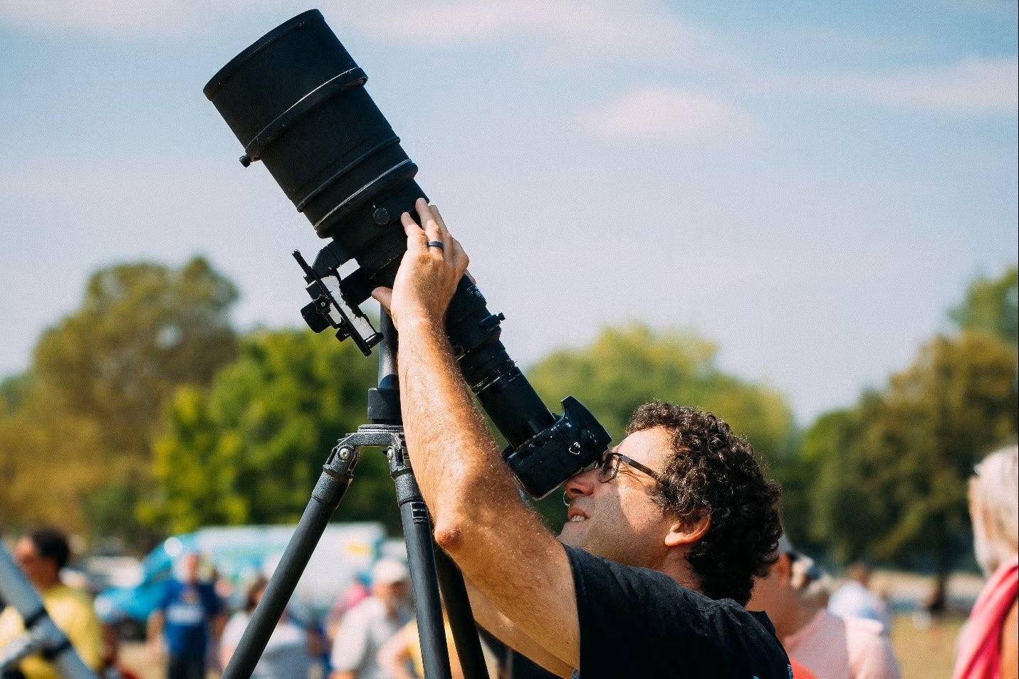 Andrew Resnick looking through a telescope