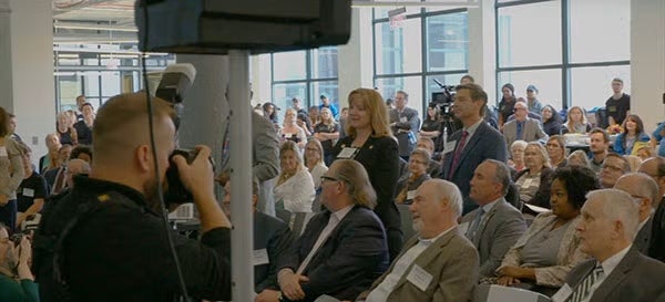 Common Area showing a ribbon-cutting event