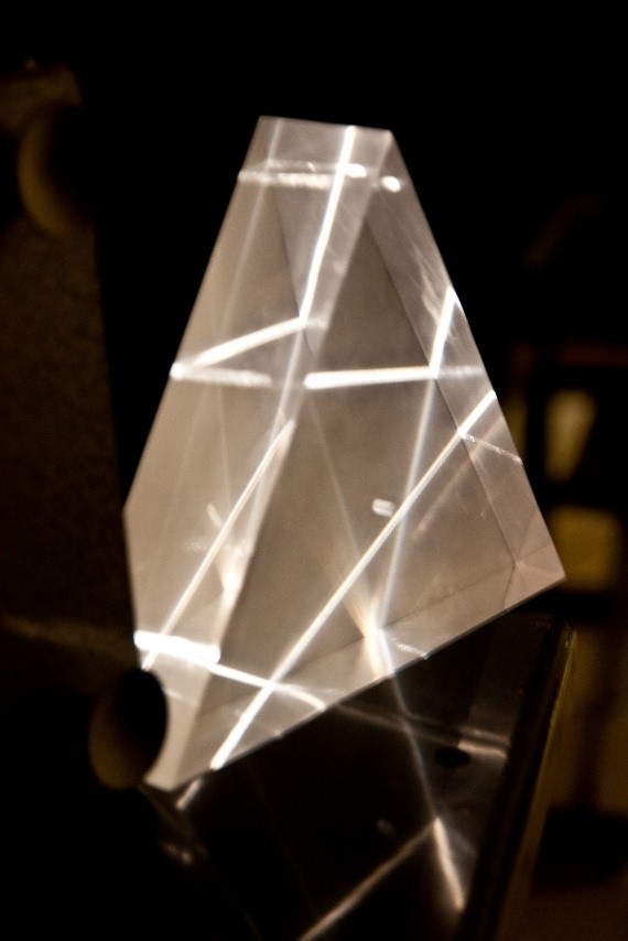 Optical laser trail through a prism