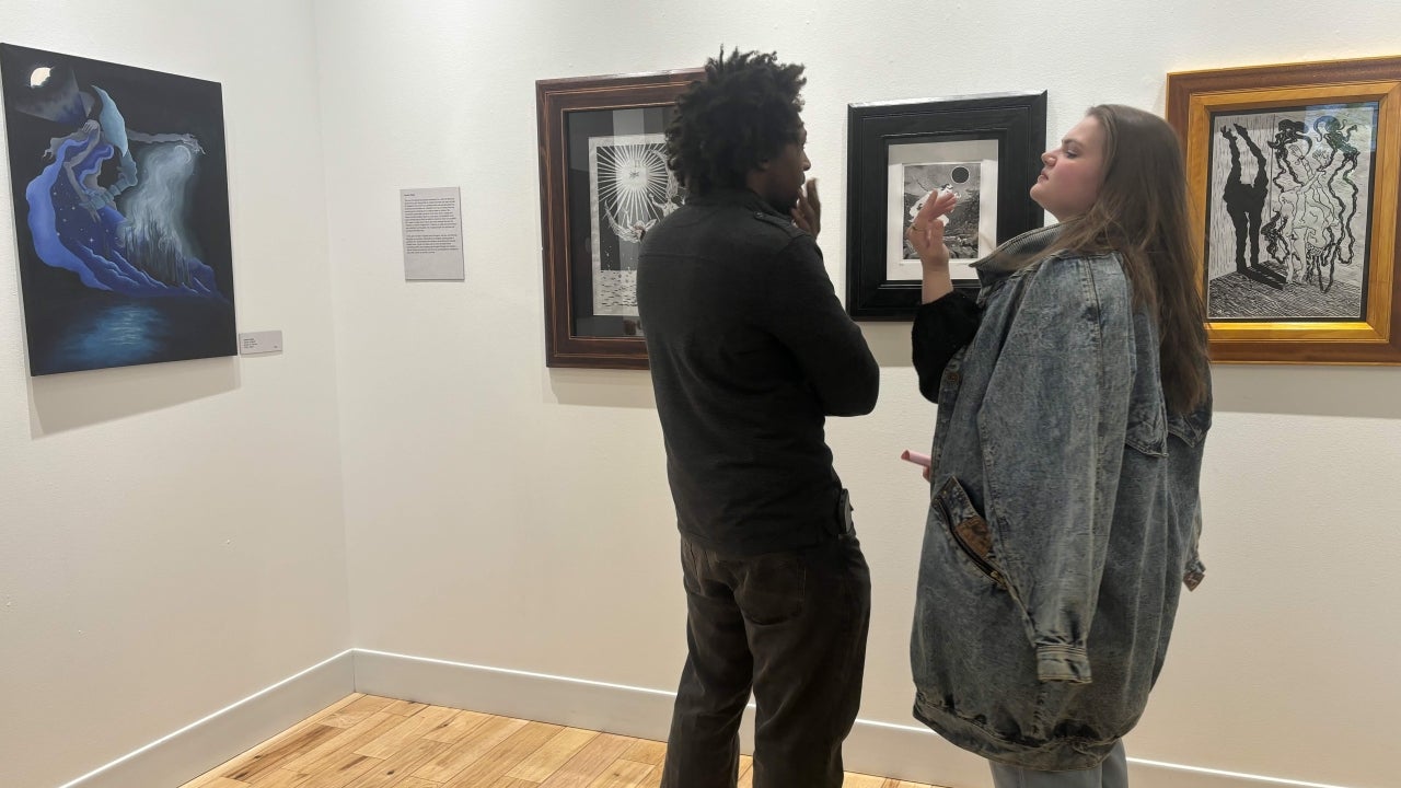 students view work at the gallery