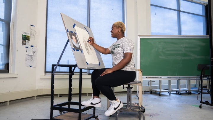 CSU Student Drawing in Art Studio