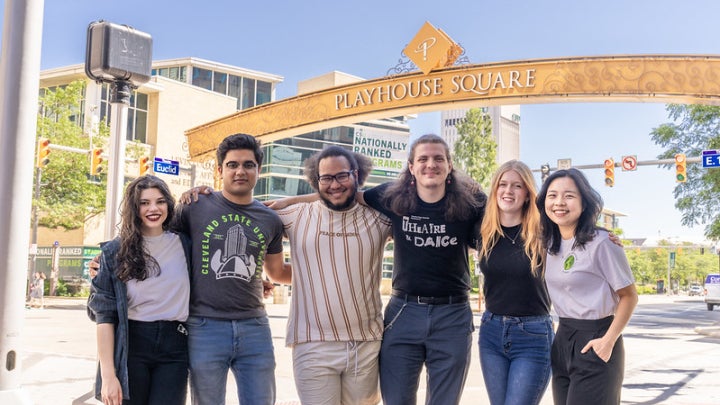 international relations students are pictured outdoors in front of a Playhouse Square entrance