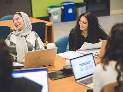 A group of students studying homework at the CSU library.