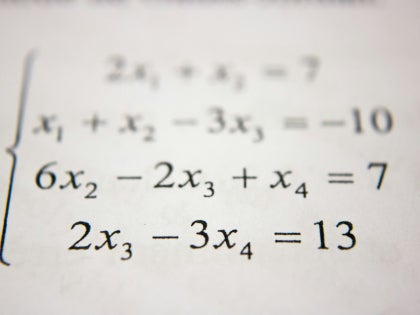 Math equations printed on white paper.