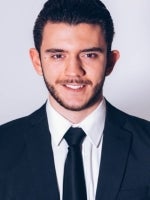 rocco in a suit