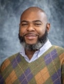 A headshot of Claude Brown