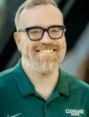 A headshot of Dr. Eric Allard